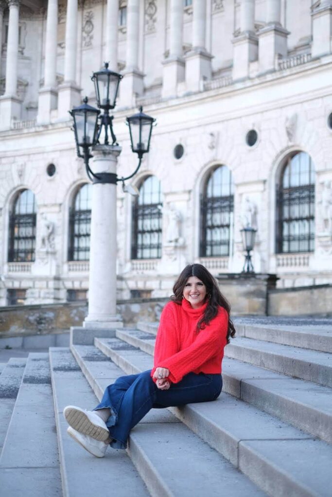 Rachel Rofé sitting on the stairs.