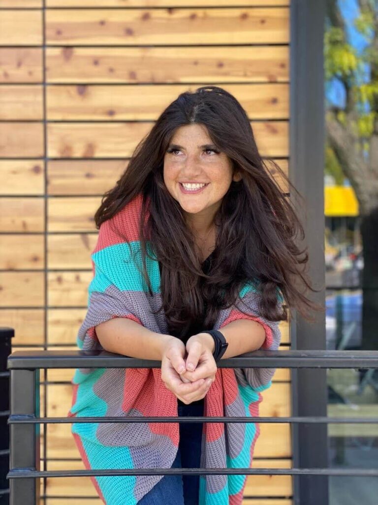 Image of Rachel Rofé leaning on a railing at a business retreat in Croatia.